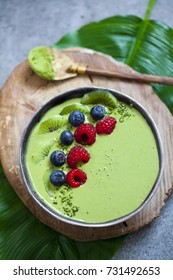 Green Matcha Smoothie With Raspberries, Blueberries And Kiwi 