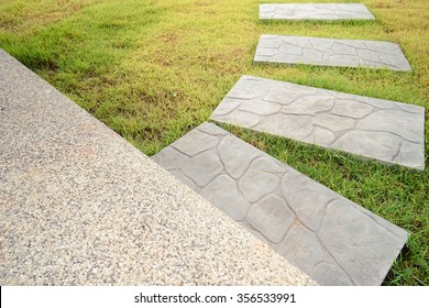 Green Meadow Divided By Rough Stone Walkway,Stamped Concrete