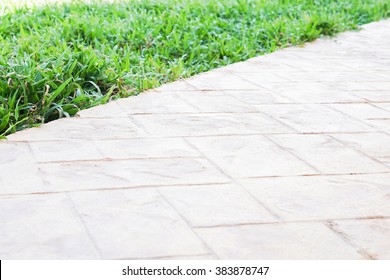 Green Meadow Divided By Rough Stone Walkway,Stamped Concrete