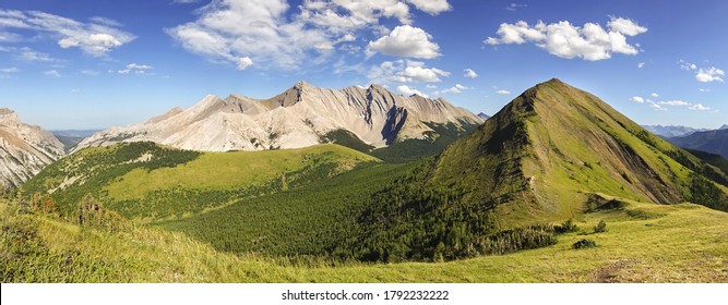 Green Meadow Grass Alpine Valley Natural Parkland and Scenic Panoramic Landscape Hiking Mist Ridge in Kananaskis Country, Alberta Foothills of Canadian Rocky Mountains on a Bright Summertime Day - Shutterstock ID 1792232222