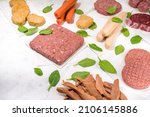 Green meat, various vegan plant based meat alternatives in different kinds – steak, minced meat, burger cutlet, nuggets, hot dog sausages, meatballs, strips