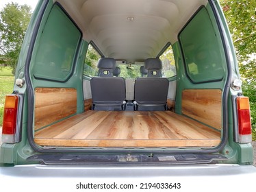 Green Microvan With Wood Paneling