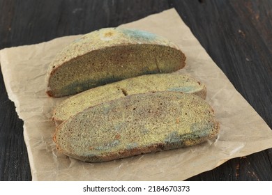 Green Mildew On A Stale Rotten Bread. Surface Of Moldy Bread. 