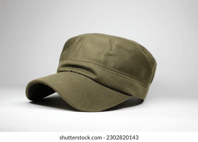 green military cap on white background Arkivfotografi