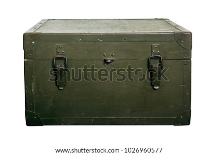 A green military storage box for ammunition. Green box from the war with scratches and locks in front.