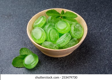 Green Mint Candy In A Wooden Bowl On A Dark Background