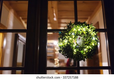 Green Mistletoe Wreath Hang On Glass Door