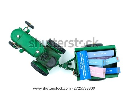 Green Model Tractor with a trailer full of Bible verses blocks.