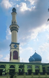 Green Mosque With Minaret And Onion Dome