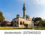 Green mosque (yesil camii) and its turquoise color minaret in Nicaea (iznik) in sunny day. Bursa, Turkey