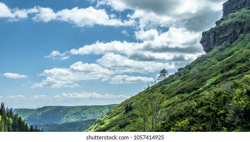 Green mountain with blue horizon