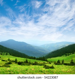 green mountain valley and blue sky with clouds - Shutterstock ID 54223087