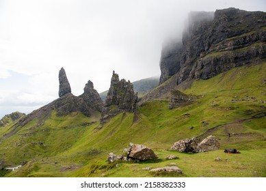 A Green Mountain Valley With Sharp Rock Formations In Rural Scotland