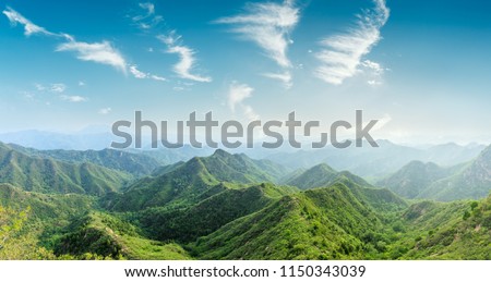 Green mountains and beautiful sky clouds under the blue sky