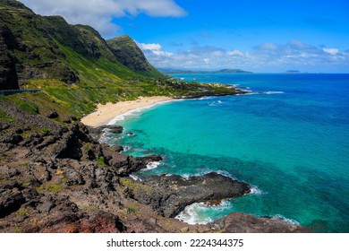 Green mountains over Makapu'u Beach Park with the translucent waters of the Pacific Ocean on the eastern side of Oahu island in Hawaii, United States - Powered by Shutterstock