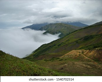 green mountainsides covered with clouds like milk on a summer day - Shutterstock ID 1540702514