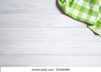 Green Napkin On The Old Wooden Table.