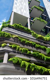 Green Nature Facade On Modern Futuristic Building In Singapore City