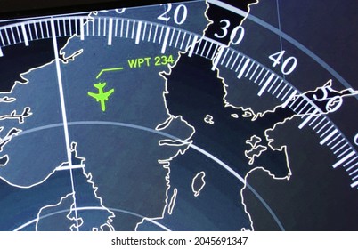 Green navigation system screen with illuminated radar image.Blue radar screen above the square grid lines and a highly detailed map, a raster copy. - Powered by Shutterstock