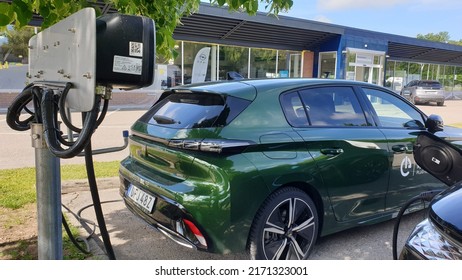 Green new Peugeot 308 2022 2023 hybrid plug-in plugin hybrid  electric car exterior in Orebro Sweden on 16.06.2022