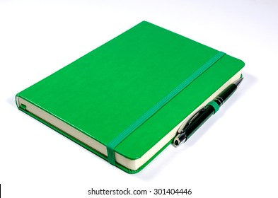 Green Notebook And Pen Isolated On White Background