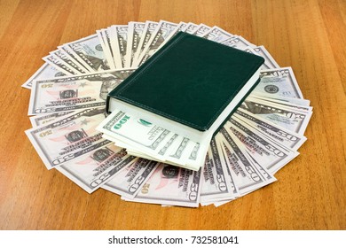 Green Notepad On Bills, Closeup, Tax Relief Concept Personal Saving