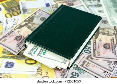 Green Notepad On Bills, Closeup, Tax Relief Concept Personal Saving