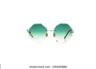 Green octagonal shaped gradient rimless sunglasses and gold metal frame at isolated white background  front view 