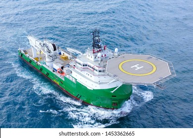 Green Offshore Supply Ship With Helipad At Sea, Aerial Image.