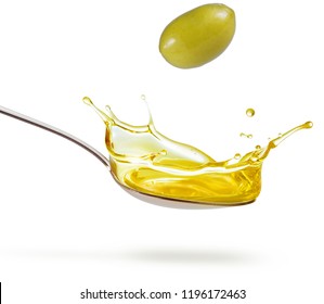 Green Olive Falling On A Splashing Spoon Of Oil Isolated On White