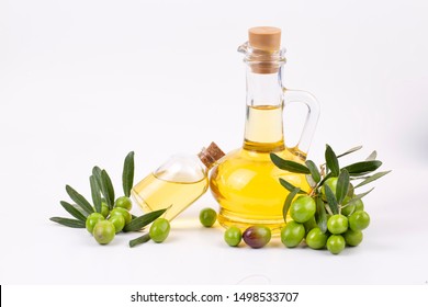 Green olive and olive oil on the white background