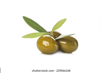 Green olives with leaves isolated on a white background - Powered by Shutterstock