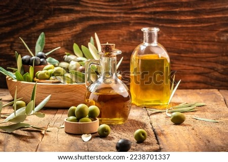 green olives with olive oil. extra virgin olive oil jars on a wooden background. place for text. Zdjęcia stock © 