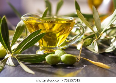 Green Olives With Olive Oil On A Dark Background