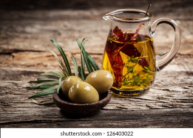 Green olives and olive oil with spice - Powered by Shutterstock