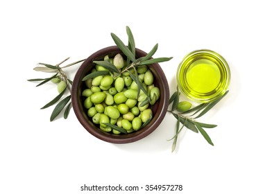 Green Olives In Wooden Bowl And Olive Oil In Glass Bowl, Isolated On White Background. Top View