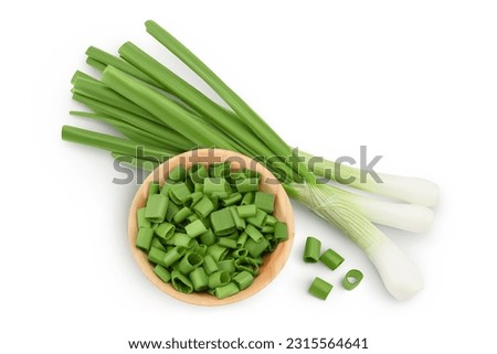 Green onion in wooden bowl isolated on the white background. Top view. Flat lay.