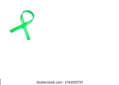 Green Organ Transplant Awareness Ribbon On White Background.Kidneys Cancer .healthcare And Medicine Concept 