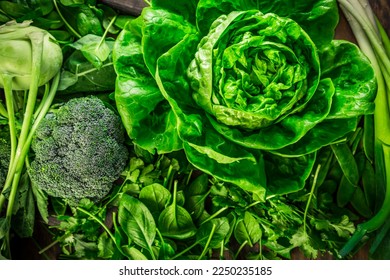Green organic vegetables and dark leafy food background as a healthy eating concept of fresh garden produce
