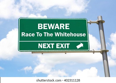 Green Overhead Road Sign With A Beware Of The Race To The Whitehouse Next Exit Concept Against A Partly Cloudy Sky Background.