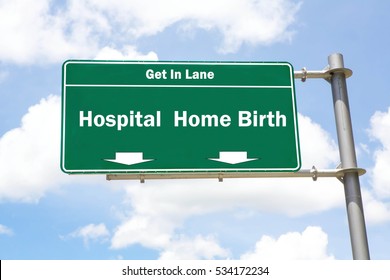 Green overhead road sign with the instruction to get in lane with a Hospital or Home Birth concept against a partly cloudy sky background.