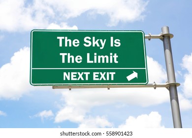 Green overhead road sign with a The Sky Is The Limit Next Exit concept against a partly cloudy sky background. - Shutterstock ID 558901423