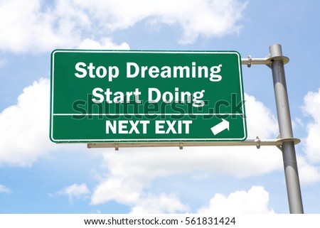Green overhead road sign with A Stop Dreaming Start Doing Next Exit concept against a partly cloudy sky background.
