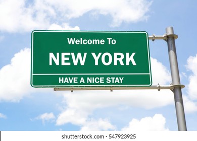 Green overhead road sign with a Welcome to New York, Have a Nice Stay concept against a partly cloudy sky background.