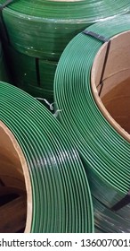 Green Packing Straps Or Tape As The Fastener. Polypropylene Tape On The Coil.