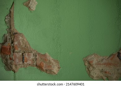 Green Paint On Brick Wall. Chipped And Faded From Age. Gives It Character Some May Say. Close Up