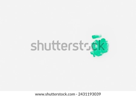 Green paint splotch on white background. Isolated design element