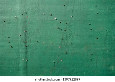 Green Painted Plywood Wall With Staples Abstract Background Texture