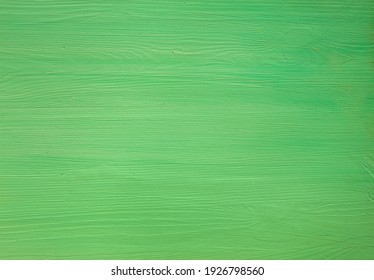 Green painted wooden background.  Top view