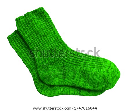 Green pair of woolen socks isolated on white background. Clipping Path included.